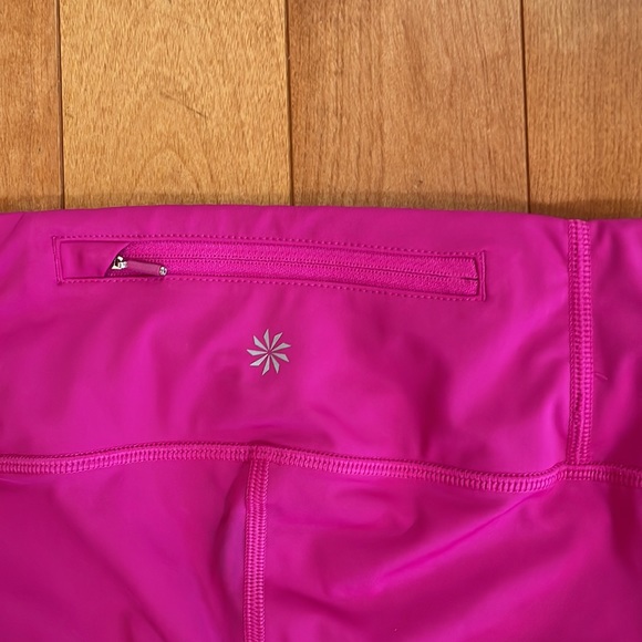 Athleta capri leggings; XS Petite; decorative hole embellishments; raspberry - Picture 5 of 6